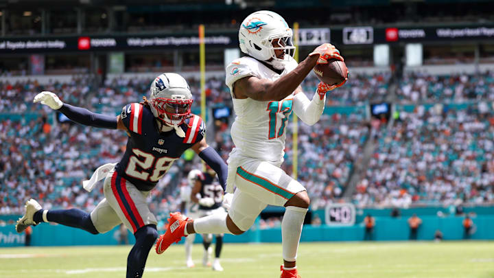 Miami Dolphins wide receiver Jaylen Waddle (17) catches a pass for a touchdown defended by New England Patriots cornerback Alex Austin (28) in the second quarter at Hard Rock Stadium. Miami Dolphins wide receiver Jaylen Waddle (17) catches a pass for a touchdown defended by New England Patriots cornerback Alex Austin (28) in the second quarter at Hard Rock Stadium.