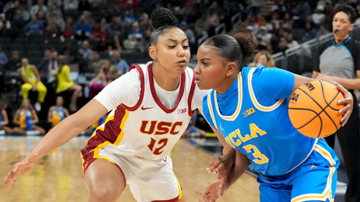 USC Trojans guard JuJu Watkins (12) guards UCLA Bruins guard Londynn Jones (3) during the first half of the 2025 TIAA Big Ten Women's Basketball Tournament final game on Sunday, March 9, 2025, at Gainbridge Fieldhouse in Indianapolis. UCLA defeated USC 72-67.