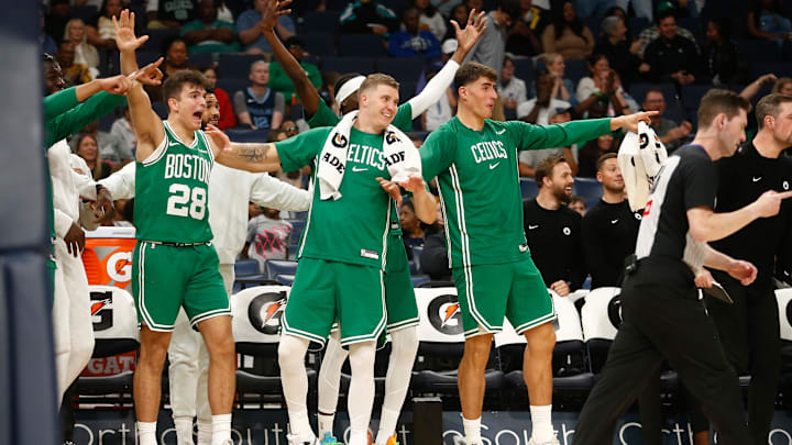 Oct 8, 2025; Memphis, Tennessee, USA; Boston Celtics guard Hugo Gonzalez (28), forward Baylor Scheierman (55) and center Luka Garza (52) react during the second quarter against the Memphis Grizzlies at FedExForum. Mandatory Credit: Petre Thomas-Imagn Images