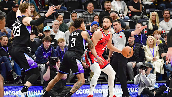 Utah Jazz guard George defends LA Clippers guard/forward Simmons during the first half at the Delta Center. Utah Jazz guard George defends LA Clippers guard/forward Simmons during the first half at the Delta Center.