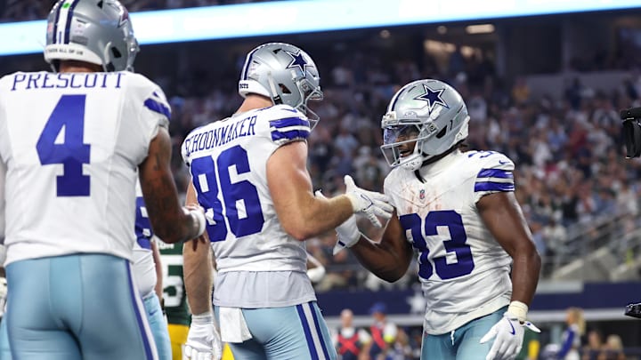 Sep 28, 2025; Arlington, Texas, USA; Dallas Cowboys running back Javonte Williams (33) celebrates with tight end Luke Schoonmaker (86) after scoring a touchdown against the Green Bay Packers in the fourth quarter at AT&T Stadium. 