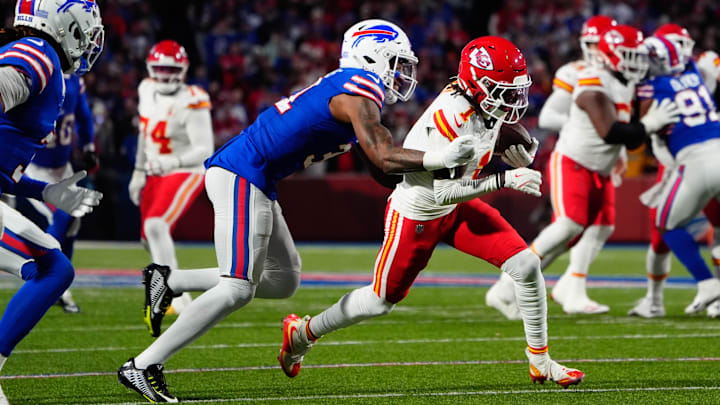 Nov 17, 2024; Orchard Park, New York, USA; Kansas City Chiefs wide receiver Xavier Worthy (1) runs with the ball against Buffalo Bills cornerback Rasul Douglas (31) after making a catch against the Buffalo Bills during the first half at Highmark Stadium