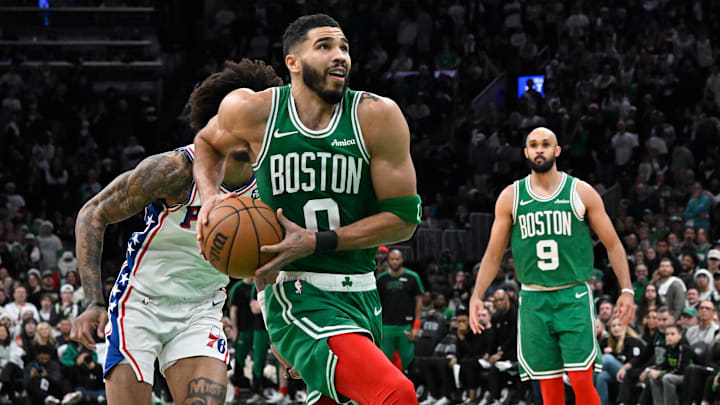 Dec 25, 2024; Boston, Massachusetts, USA; Boston Celtics forward Jayson Tatum (0) lines up for a dunk against the Philadelphia 76ers during the second half at TD Garden. Mandatory Credit: Eric Canha-Imagn Images