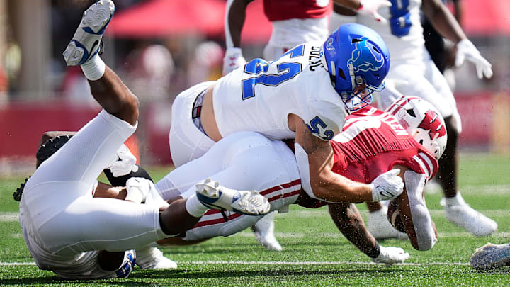 Buffalo safety Marcus Fuqua (10) and linebacker Shaun Dolac (52) take down Wisconsin running back Braelon Allen (0) during the first quarter of the game on Saturday September 2, 2023 at Camp Randall Stadium in Madison, Wis. Buffalo safety Marcus Fuqua (10) and linebacker Shaun Dolac (52) take down Wisconsin running back Braelon Allen (0) during the first quarter of the game on Saturday September 2, 2023 at Camp Randall Stadium in Madison, Wis.
