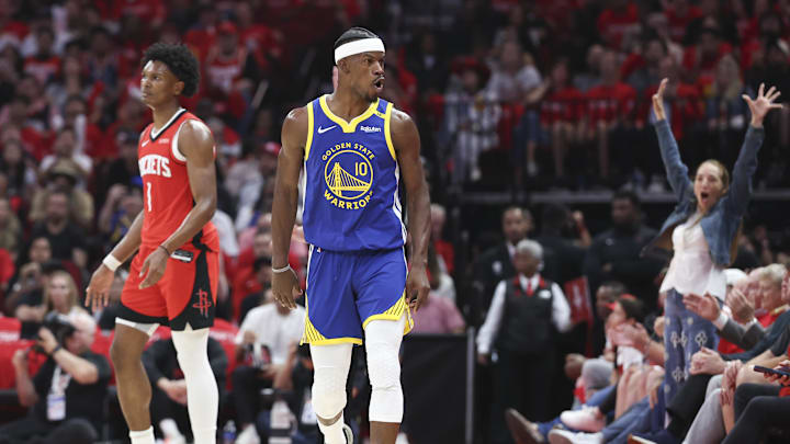 Apr 20, 2025; Houston, Texas, USA; Houston Rockets forward Amen Thompson (1) and Golden State Warriors forward Jimmy Butler III (10) react after Butler scores a basket during the third quarter at Toyota Center. Mandatory Credit: Troy Taormina-Imagn Images