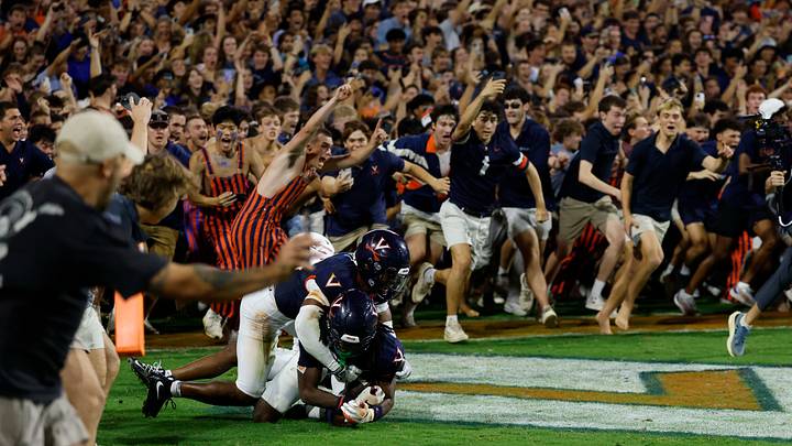 Sep 26, 2025; Charlottesville, Virginia, USA; Virginia Cavaliers defensive back Ja'son Prevard (10) is hugged by Cavaliers defensive back Donavon Platt (28) as fans storm the field after defeating No. 8 Florida State. Mandatory Credit: Geoff Burke-Imagn Images Sep 26, 2025; Charlottesville, Virginia, USA; Virginia Cavaliers defensive back Ja'son Prevard (10) is hugged by Cavaliers defensive back Donavon Platt (28) as fans storm the field after defeating No. 8 Florida State. Mandatory Credit: Geoff Burke-Imagn Images