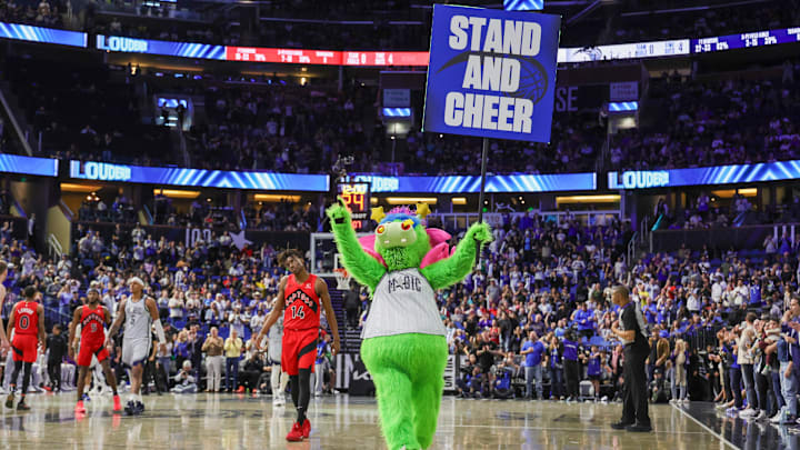 Orlando Magic mascot Stuff gets the fans to stand and cheer during the second half against the Toronto Raptors at Kia Center.