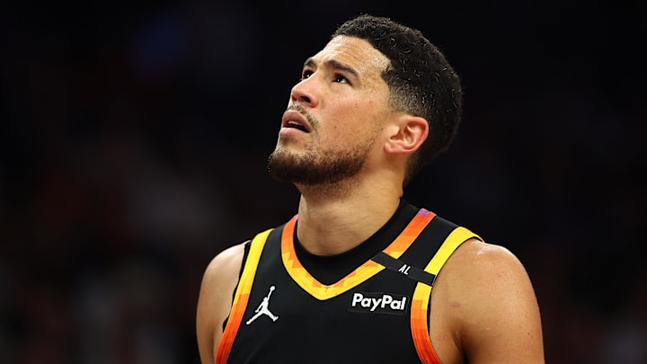 Apr 9, 2025; Phoenix, Arizona, USA; Phoenix Suns guard Devin Booker (1) reacts after a play against the Oklahoma City Thunder during the first half at Footprint Center. Mandatory Credit: Mark J. Rebilas-Imagn Images