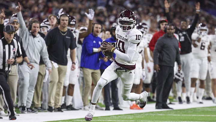 Dec 27, 2023; Houston, TX, USA; Texas A&M Aggies quarterback Marcel Reed (10) runs and scores a