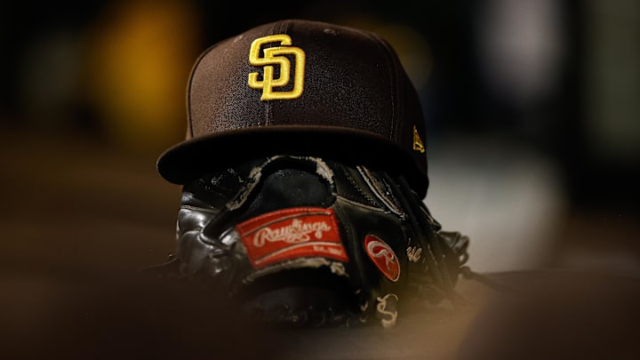 San Diego Padres hat on a glove