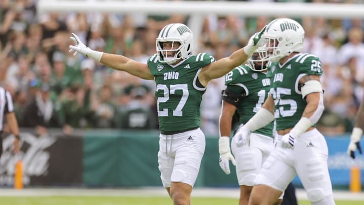 Sep 6, 2025; Athens, Ohio, USA; Ohio Bobcats linebacker Jack Fries (27) celebrates after a defensive stop during the first quarter against the West Virginia Mountaineers at Peden Stadium. Mandatory Credit: Ben Queen-Imagn Images
