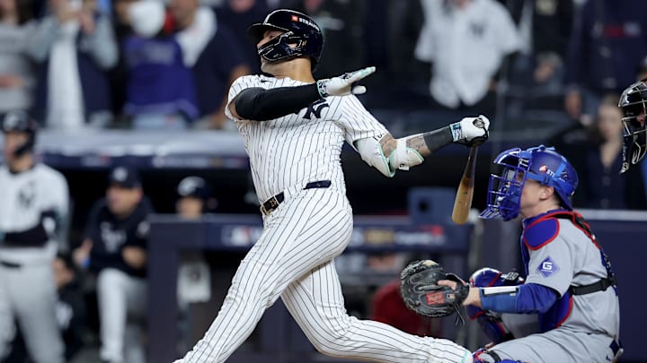 Oct 29, 2024; New York, New York, USA; New York Yankees second baseman Gleyber Torres (25) hits a three-run home run during the eighth inning against the Los Angeles Dodgers in game four of the 2024 MLB World Series at Yankee Stadium. 