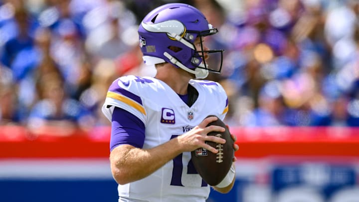 Sep 8, 2024; East Rutherford, New Jersey, USA; Minnesota Vikings quarterback Sam Darnold (14) drops back to pass against the New York Giants during the first half at MetLife Stadium. Sep 8, 2024; East Rutherford, New Jersey, USA; Minnesota Vikings quarterback Sam Darnold (14) drops back to pass against the New York Giants during the first half at MetLife Stadium.