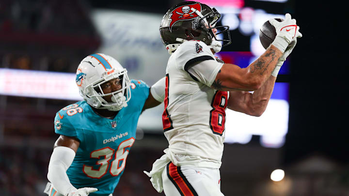 Tampa Bay Buccaneers wide receiver Ryan Miller (81) receives a pass for a touchdown defended by Miami Dolphins cornerback Storm Duck (36) in the second quarter during preseason at Raymond James Stadium. 