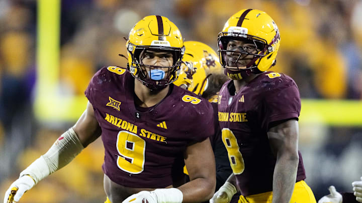 Nov 28, 2025; Tempe, Arizona, USA; Arizona State Sun Devils defensive lineman Elijah O'Neal (9) and linebacker Jordan Crook (8) against the Arizona Wildcats during the 99th Territorial Cup at Mountain America Stadium. Mandatory Credit: Mark J. Rebilas-Imagn Images Nov 28, 2025; Tempe, Arizona, USA; Arizona State Sun Devils defensive lineman Elijah O'Neal (9) and linebacker Jordan Crook (8) against the Arizona Wildcats during the 99th Territorial Cup at Mountain America Stadium. Mandatory Credit: Mark J. Rebilas-Imagn Images