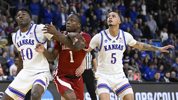 Mar 20, 2025; Providence, RI, USA;  Arkansas Razorbacks guard Johnell Davis (1) and Kansas Jayhawks forward Flory Bidunga (40) and guard Zeke Mayo (5) look on during the second half at Amica Mutual Pavilion. Mandatory Credit: Eric Canha-Imagn Images