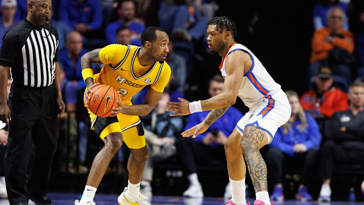 Jan 14, 2025; Gainesville, Florida, USA; Missouri Tigers guard Tamar Bates (2) looks to pass while Florida Gators guard Alijah Martin (15) defends during the second half at Exactech Arena at the Stephen C. O'Connell Center. Mandatory Credit: Matt Pendleton-Imagn Images