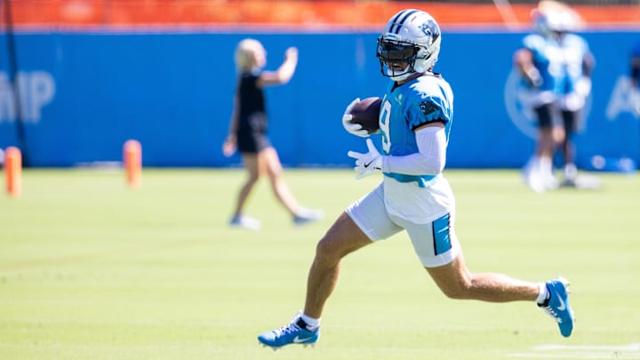 Carolina Panthers wide receiver Adam Thielen runs after a catch during practice at training camp.