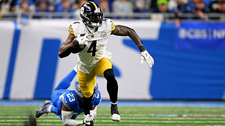 Dec 21, 2025; Detroit, Michigan, USA; Detroit Lions cornerback Rock Ya-Sin (23) tackles Pittsburgh Steelers wide receiver DK Metcalf (4) during the fourth quarter at Ford Field. Mandatory Credit: Lon Horwedel-Imagn Images