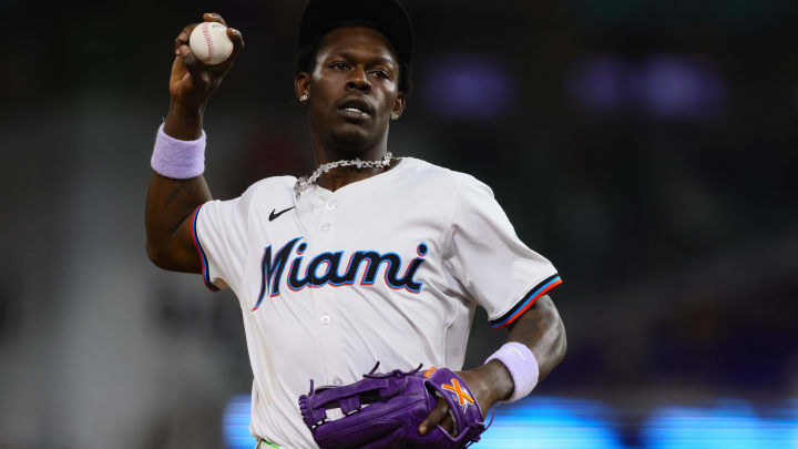 May 20, 2024; Miami, Florida, USA; Miami Marlins center fielder Jazz Chisholm Jr. (2) tosses a baseball to the fans in the tenth inning against the Milwaukee Brewers at loanDepot Park.