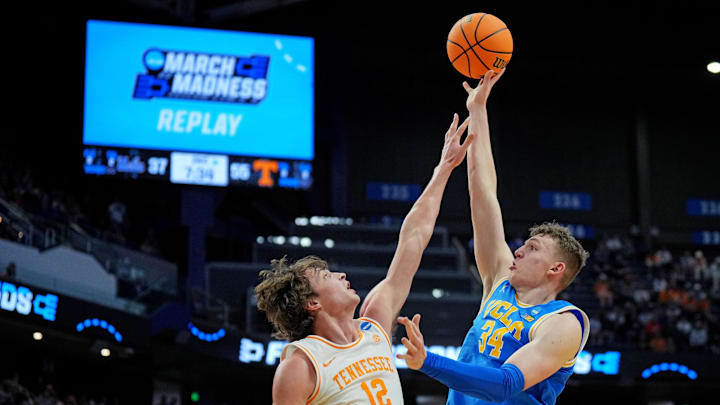 Mar 22, 2025; Lexington, KY, USA; UCLA Bruins forward Tyler Bilodeau (34) shoots the ball against Tennessee Volunteers forward Cade Phillips (12) during the second half in the second round of the NCAA Tournament at Rupp Arena. Mandatory Credit: Aaron Doster-Imagn Images