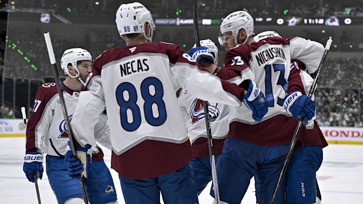 Apr 21, 2025; Dallas, Texas, USA; Colorado Avalanche left wing Jonathan Drouin (27) and center Martin Necas (88) and right wing Valeri Nichushkin (13) and center Nathan MacKinnon (29) celebrates a a power-play goal scored by MacKinnon against the Dallas Stars during the first period in game two of the first round of the 2025 Stanley Cup Playoffs at American Airlines Center. Mandatory Credit: Jerome Miron-Imagn Images