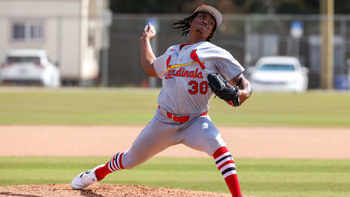 Feb 14, 2026; Jupiter, FL, USA; St. Louis Cardinals pitcher Tink Hence (30) delivers a pitch during a spring training workout at Roger Dean Chevrolet Stadium. Mandatory Credit: Sam Navarro-Imagn Images