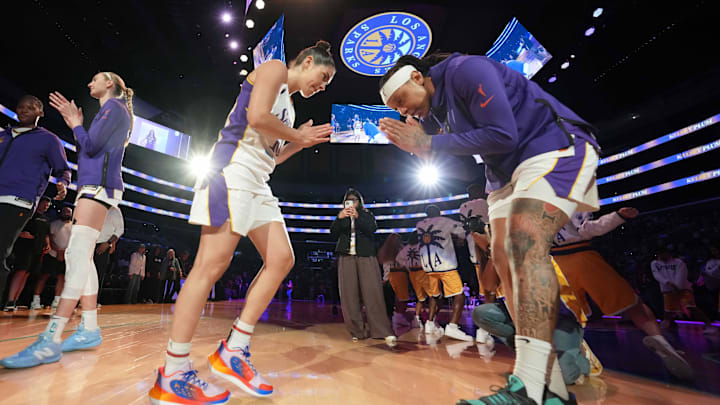 Aug 31, 2025; Los Angeles, California, USA; LA Sparks guard Kelsey Plum (10) interacts with forward Emma Cannon (right) before the game against the Washington Mystics at Crypto.com Arena. Mandatory Credit: Kirby Lee-Imagn Images
