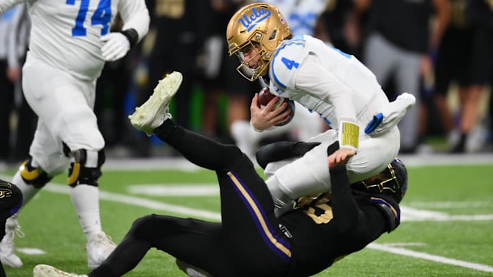 Russell Davis II picks one of his three sacks of UCLA quarterback Ethan Garbers, a performance that earned him Big Ten Co-Defensive Player of the Week. 