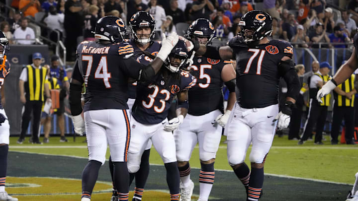 Aug 17, 2025; Chicago, Illinois, USA; Chicago Bears running back Ian Wheeler (33) celebrates his touchdown against the Buffalo Bills with guard Jordan McFadden (74) during the first half at Soldier Field. Mandatory Credit: David Banks-Imagn Images
