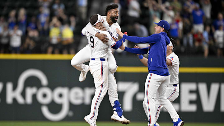May 13, 2026; Arlington, Texas, USA;  Texas Rangers catcher Danny Jansen (9) and second baseman Ezequiel Duran (20) and starting pitcher MacKenzie Gore (1) and center fielder Sam Haggerty (0) celebrate after Jansen hits a single and drives in the game winning run against the Arizona Diamondbacks during the ninth inning at Globe Life Field. Mandatory Credit: Jerome Miron-Imagn Images