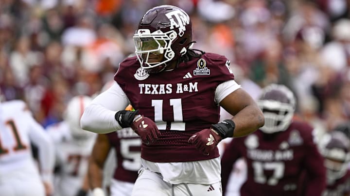 Dec 20, 2025; College Station, TX, USA; Texas A&M Aggies defensive tackle Tyler Onyedim (11) celebrates during the game between the Aggies and the Hurricanes at Kyle Field. 