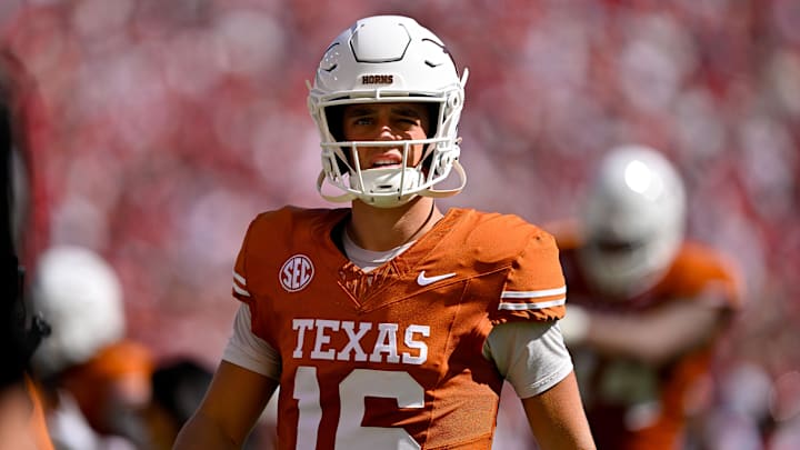 Texas Longhorns quarterback Arch Manning looks on during the first half against the Oklahoma Sooners at the Cotton Bowl. Texas Longhorns quarterback Arch Manning looks on during the first half against the Oklahoma Sooners at the Cotton Bowl.
