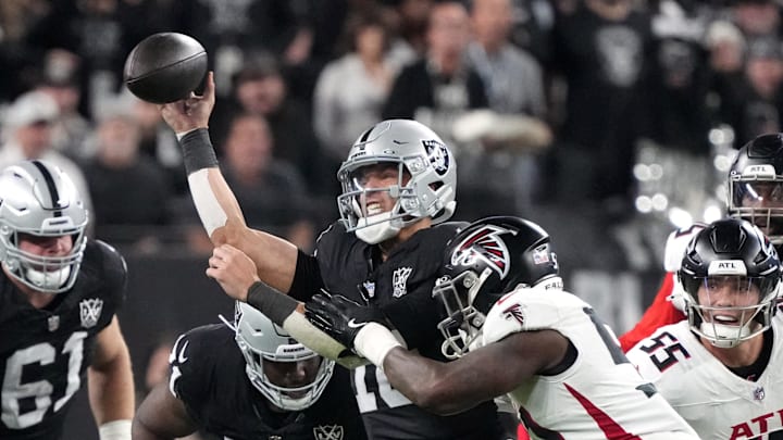 Dec 16, 2024; Paradise, Nevada, USA; Las Vegas Raiders quarterback Desmond Ridder (10) throws the ball against Atlanta Falcons linebacker DeAngelo Malone (51) in the second half at Allegiant Stadium. Mandatory Credit: Kirby Lee-Imagn Images Dec 16, 2024; Paradise, Nevada, USA; Las Vegas Raiders quarterback Desmond Ridder (10) throws the ball against Atlanta Falcons linebacker DeAngelo Malone (51) in the second half at Allegiant Stadium. Mandatory Credit: Kirby Lee-Imagn Images