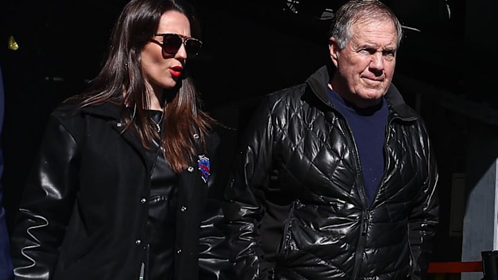 Former New England Patriots head coach Bill Belichick and girlfriend Jordon Hudson enter the field before the game between the Notre Dame Fighting Irish and the Navy Midshipmen at MetLife Stadium.