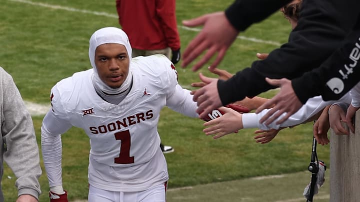 Nov 18, 2023; Provo, Utah, USA; Oklahoma Sooners wide receiver Jayden Gibson (1) slaps hands with fans after a win over the Brigham Young Cougars at LaVell Edwards Stadium. Mandatory Credit: Rob Gray-Imagn Images