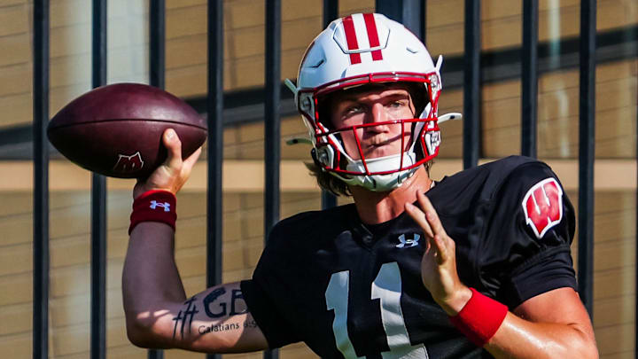 Wisconsin quarterback Mabrey Mettauer (11) looks to pass during football practice Wednesday, August 14, 2024 in Madison, Wisconsin. Wisconsin quarterback Mabrey Mettauer (11) looks to pass during football practice Wednesday, August 14, 2024 in Madison, Wisconsin.