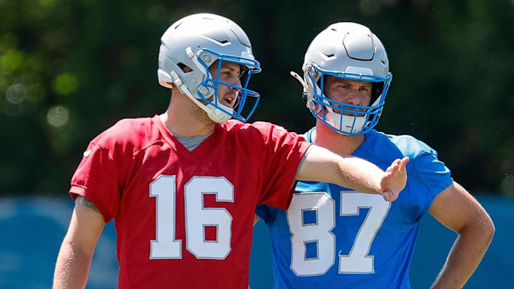 Detroit Lions quarterback Jared Goff (16) talks to tight end Sam LaPorta (87) after practice during OTAs at Detroit Lions headquarters and training facility in Allen Park on Thursday, May 30, 2024.