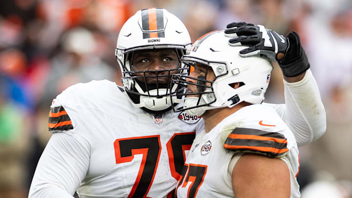 Oct 15, 2023; Cleveland, Ohio, USA; Cleveland Browns offensive tackle Dawand Jones (79) hugs guard Wyatt Teller (77) as they celebrate the team   s win against the San Francisco 49ers during the fourth quarter at Cleveland Browns Stadium. Mandatory Credit: Scott Galvin-Imagn Images