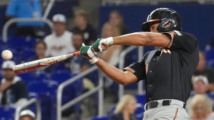 Miami Third baseman Daniel Cuvet against FIU smashing a grand slam in loanDepot Park Miami Third baseman Daniel Cuvet against FIU smashing a grand slam in loanDepot Park