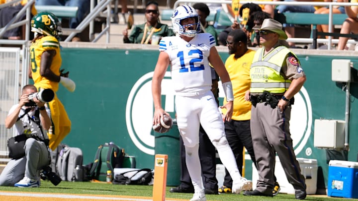 Sep 28, 2024; Waco, Texas, USA; Brigham Young Cougars quarterback Jake Retzlaff (12) celebrates after scoring a touchdown against the Baylor Bears during the first half at McLane Stadium. Mandatory Credit: Chris Jones-Imagn Images Sep 28, 2024; Waco, Texas, USA; Brigham Young Cougars quarterback Jake Retzlaff (12) celebrates after scoring a touchdown against the Baylor Bears during the first half at McLane Stadium. Mandatory Credit: Chris Jones-Imagn Images