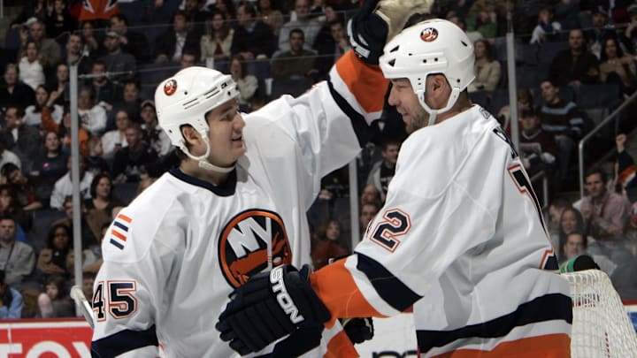 Mar 3, 2007; Washington, DC, USA; New York Islanders left wing (12) Chris Simon celebrates with right wing (45) Arron Asham after scoring a goal in the second period against the Washington Capitals at the Verizon Center in Washington, DC.  Mandatory Credit: James Lang-Imagn Images Copyright © James Lang