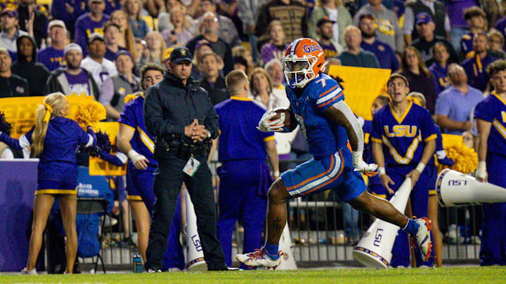 Nov 11, 2023; Baton Rouge, Louisiana, USA;  Florida Gators running back Trevor Etienne (7) rushes in