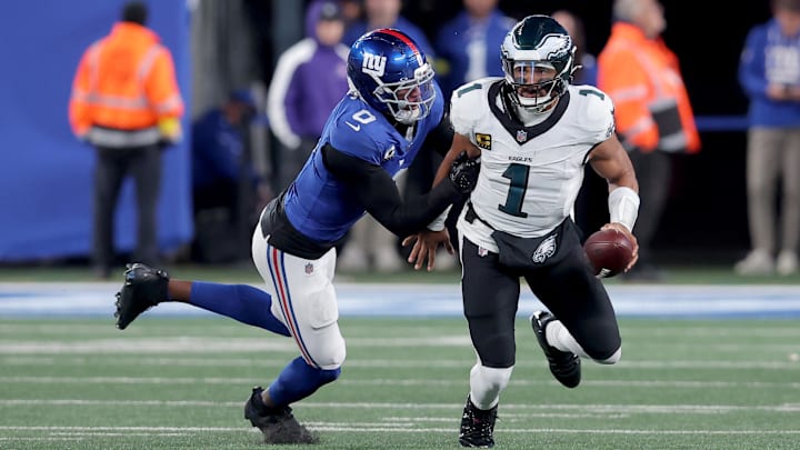 Brian Burns applies the pressures to Eagles quarterback Jalen Hurts. Burns leads the NFL in sacks.