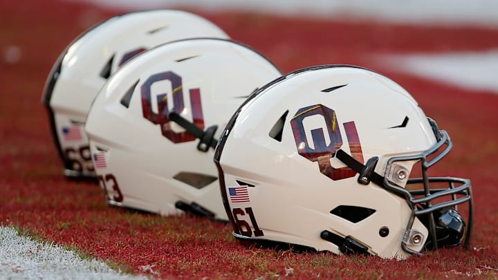 Oklahoma football helmets sit in the end zone.