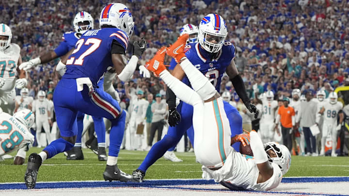 Sep 18, 2025; Orchard Park, New York, USA; Miami Dolphins wide receiver Jaylen Waddle (17) scores a touchdown against Buffalo Bills cornerback Tre'Davious White (27)