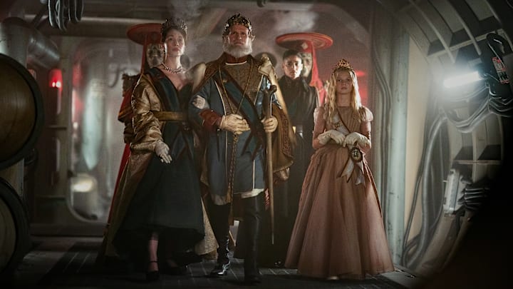 Rebel Moon — Part Two: The Scargiver. (Featured L-R) Rhian Rees as The Queen, Cary Elwes as The King, Sofia Boutella as Kora and Stella Grace Fitzgerald as Princess Issa in Rebel Moon — Part Two: The Scargiver. Cr. Clay Enos/Netflix ©2023.