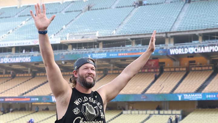 Dodgers pitcher Clayton Kershaw waves to the crowd during the 2025 World Series championship celebration at Dodger Stadium in Los Angeles on Monday, Nov. 3, 2025.