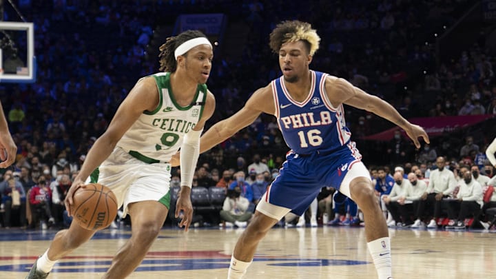 Jan 14, 2022; Philadelphia, Pennsylvania, USA; Boston Celtics shooting guard Romeo Langford (9) dribbles the ball against Philadelphia 76ers guard Charlie Brown Jr. (16) defending during the second half at Wells Fargo Center. Mandatory Credit: Gregory Fisher-Imagn Images