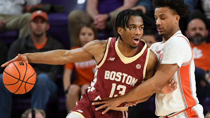 Boston College Eagles guard Donald Hand Jr. (13) is defended by Clemson Tigers guard Efrem Johnson (4) Tuesday, Jan. 13, 2026, during the NCAA men’s basketball game at Littlejohn Coliseum in Clemson, South Carolina.
